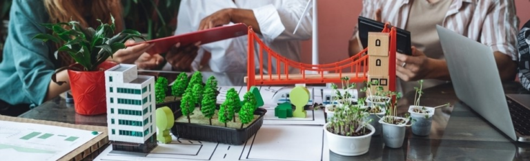 Table with model bridge, buildings and trees